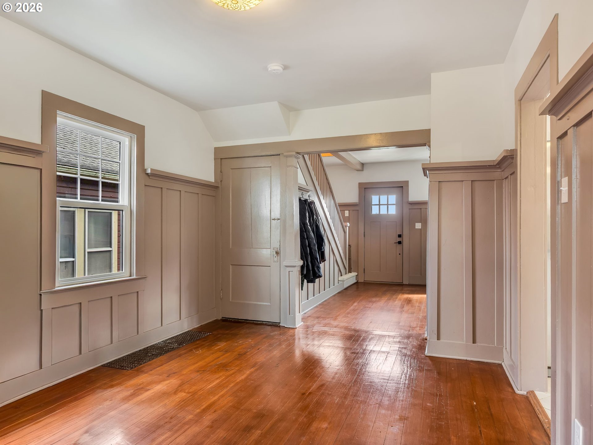 933 8th Street Astoria, OR 97103 - Photo 6 of 31 an empty room with wooden floor and a window