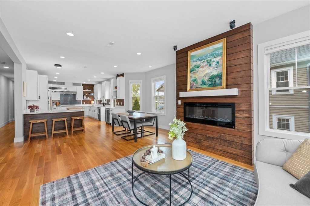 61 Paul Revere Road, Unit 2 Arlington, MA 02476 - Photo 1 of 33 a living room with furniture and a fireplace