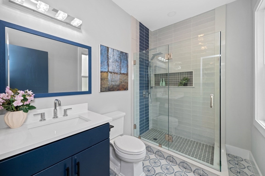 61 Paul Revere Road, Unit 2 Arlington, MA 02476 - Photo 18 of 33 a bathroom with a sink toilet and shower