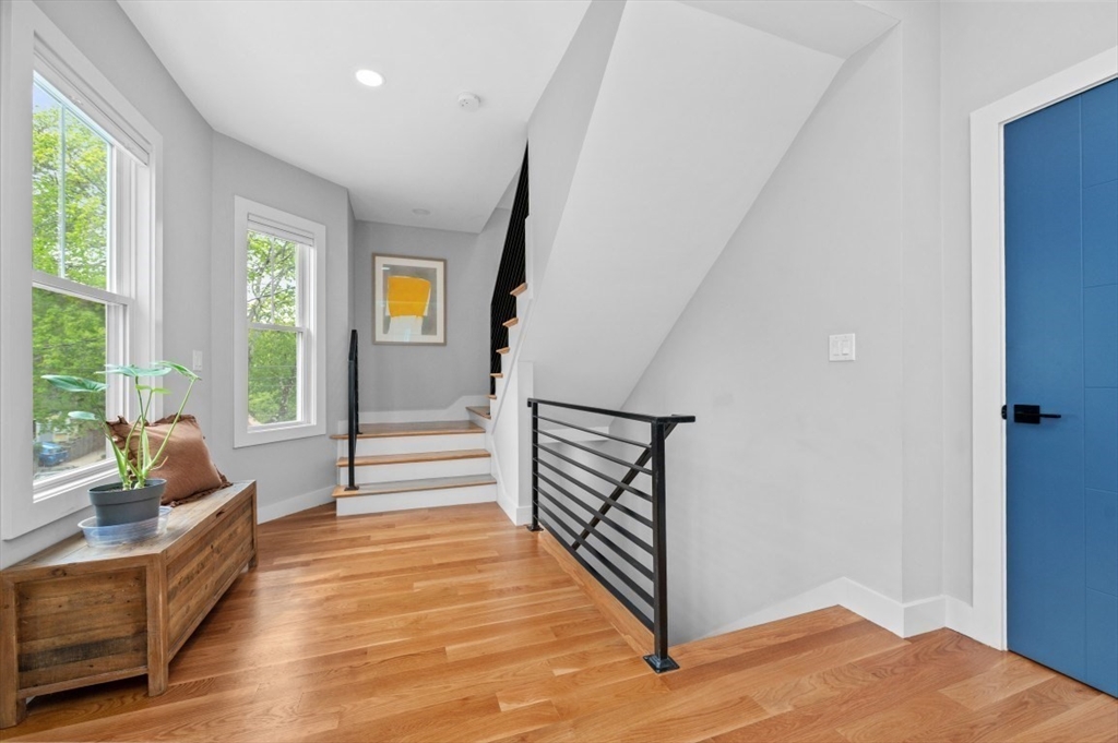 61 Paul Revere Road, Unit 2 Arlington, MA 02476 - Photo 19 of 33 a view of a hallway with window and stairs