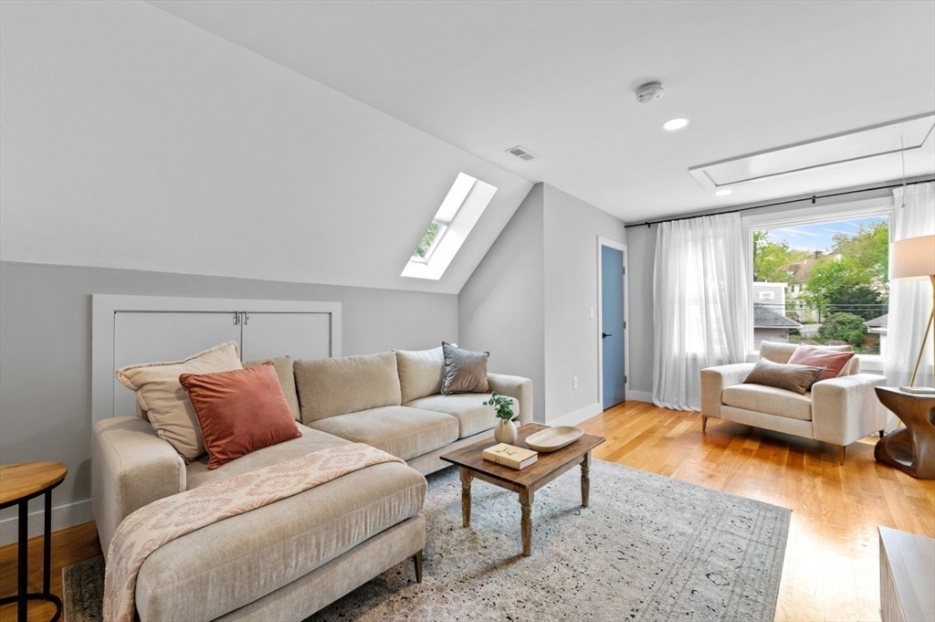 61 Paul Revere Road, Unit 2 Arlington, MA 02476 - Photo 21 of 33 a living room with furniture and a large window