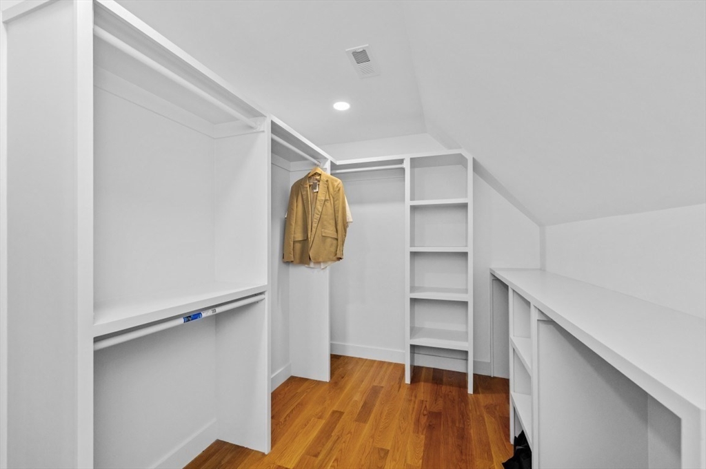 61 Paul Revere Road, Unit 2 Arlington, MA 02476 - Photo 28 of 33 a view of walk in closet with empty racks
