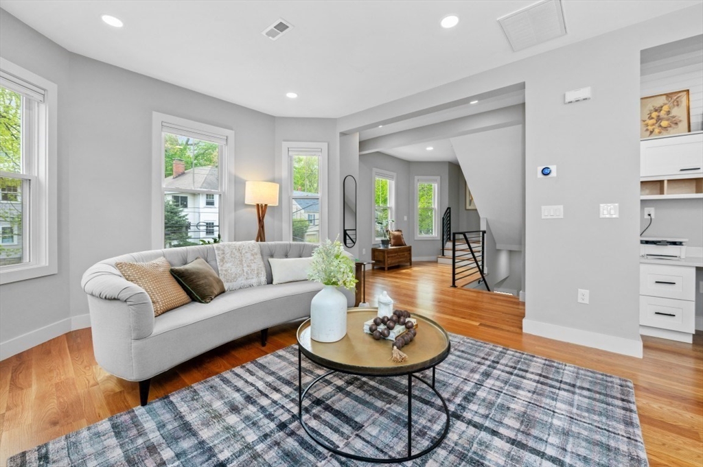 61 Paul Revere Road, Unit 2 Arlington, MA 02476 - Photo 3 of 33 a living room with furniture and wooden floor