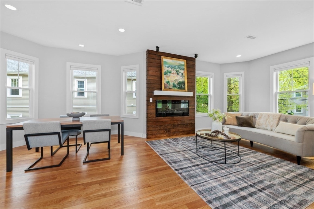 61 Paul Revere Road, Unit 2 Arlington, MA 02476 - Photo 6 of 33 a living room with furniture and a fireplace
