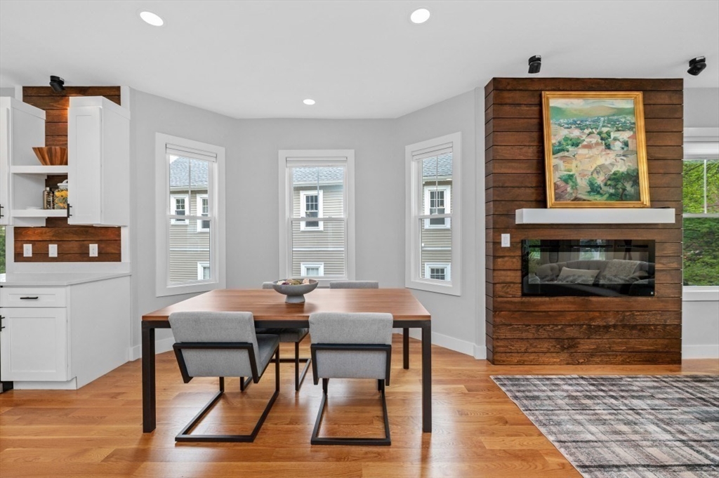 61 Paul Revere Road, Unit 2 Arlington, MA 02476 - Photo 7 of 33 a view of a dining room with furniture window and wooden floor