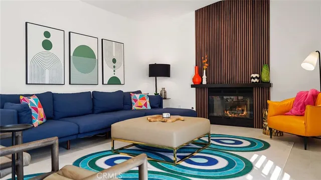 a dining room with furniture a chandelier and a rug