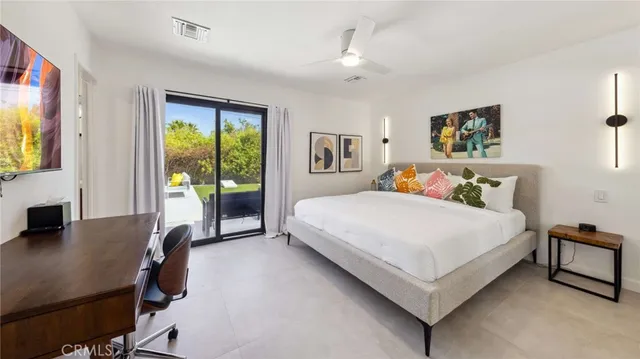 a bathroom with a double vanity sink toilet and shower