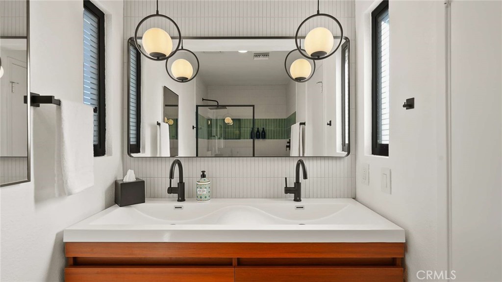 2004 East Nicola Road Palm Springs, CA 92262 - Photo 24 of 40 a bathroom with a sink and a mirror