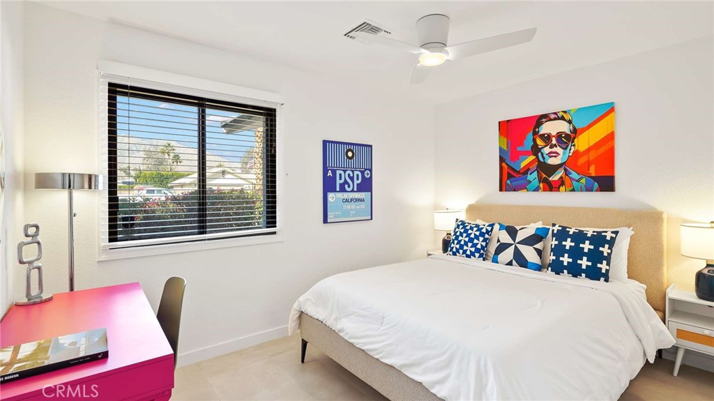 2004 East Nicola Road Palm Springs, CA 92262 - Photo 26 of 40 a bedroom with a bed and a painting on the wall