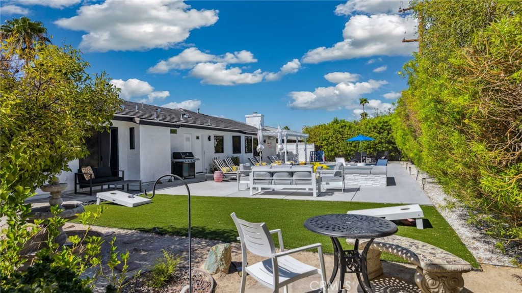 2004 East Nicola Road Palm Springs, CA 92262 - Photo 33 of 40 a view of a house with backyard sitting area and garden