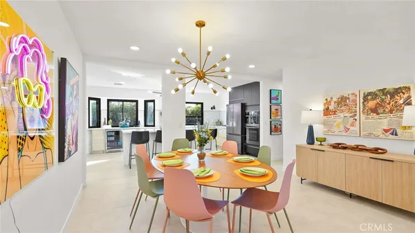 a dining room with furniture and wooden floor