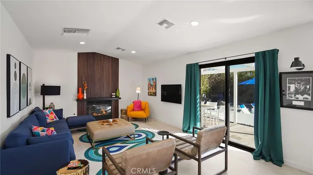 a view of a chairs and table in the patio