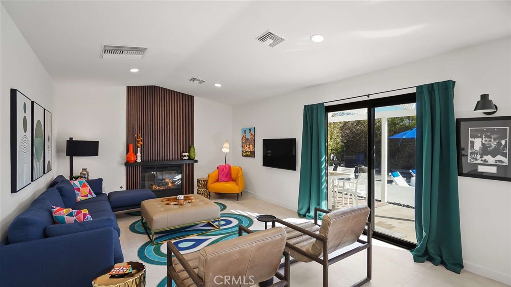 2004 East Nicola Road Palm Springs, CA 92262 - Photo 9 of 40 a living room with furniture and a flat screen tv