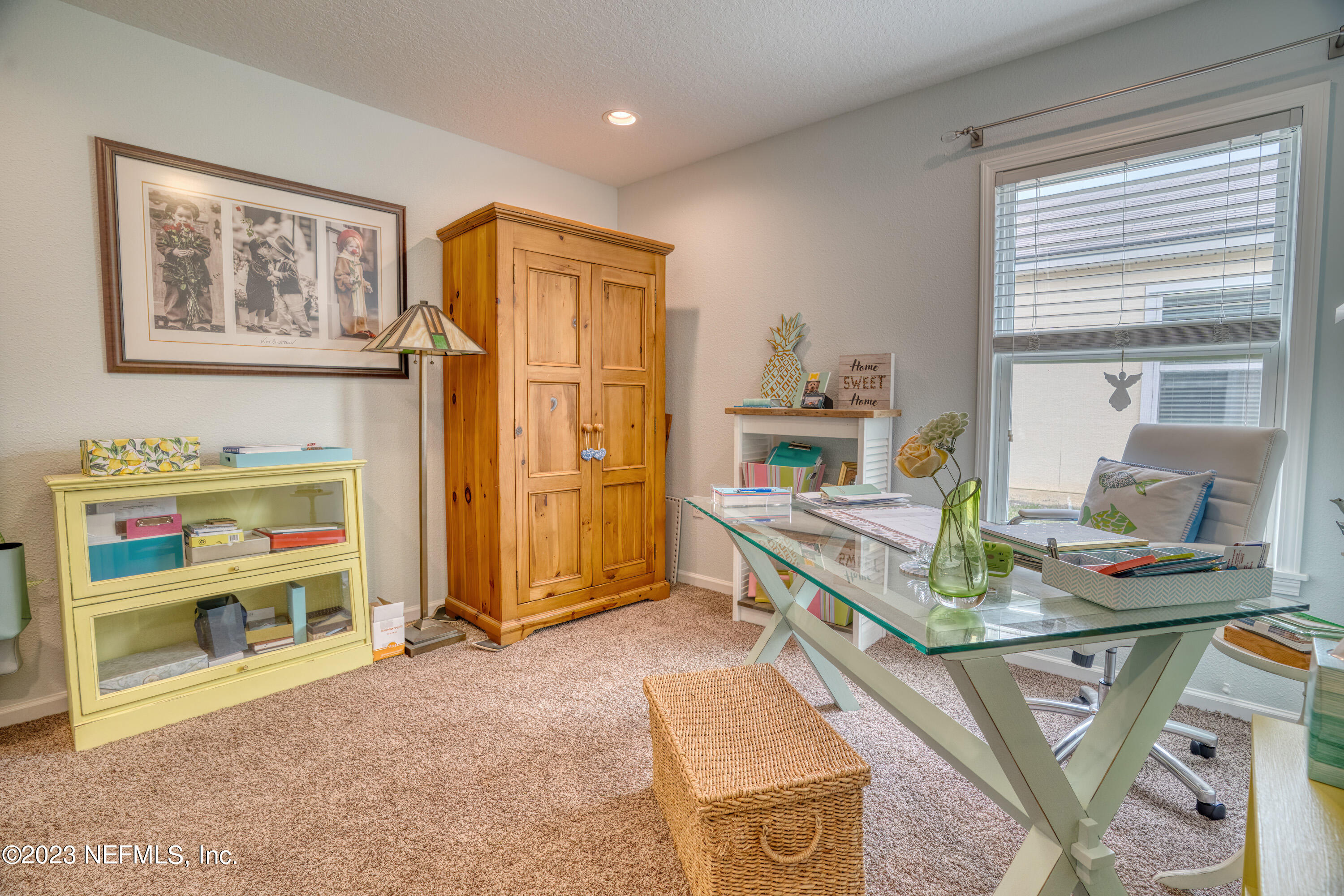 583 Ashby Landing Way St. Augustine, FL 32086 - Photo 24 of 48 a living room with stainless steel appliances furniture a rug and a window
