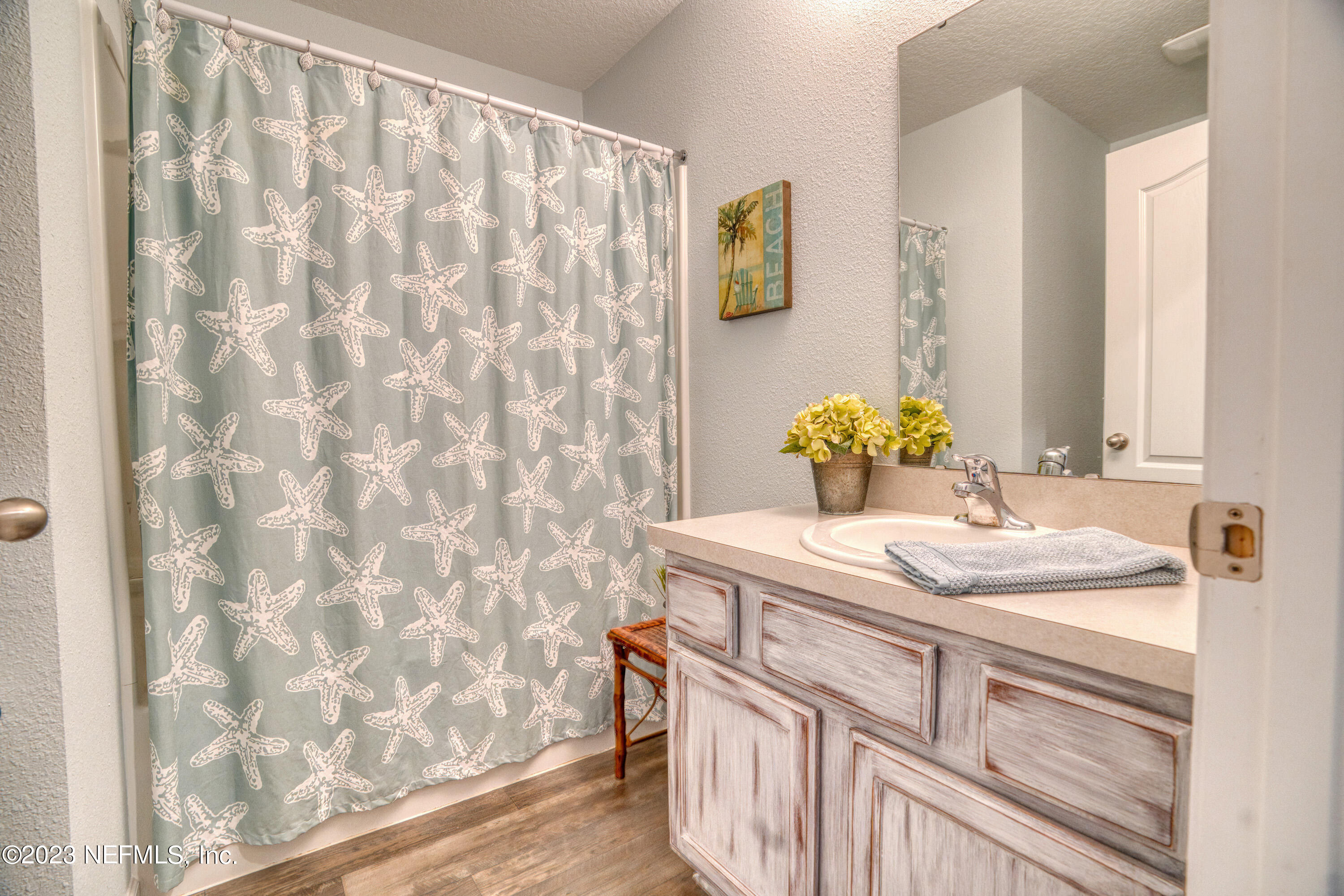 583 Ashby Landing Way St. Augustine, FL 32086 - Photo 26 of 48 a bathroom with a sink and a mirror