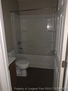a bathroom with a shower and a toilet