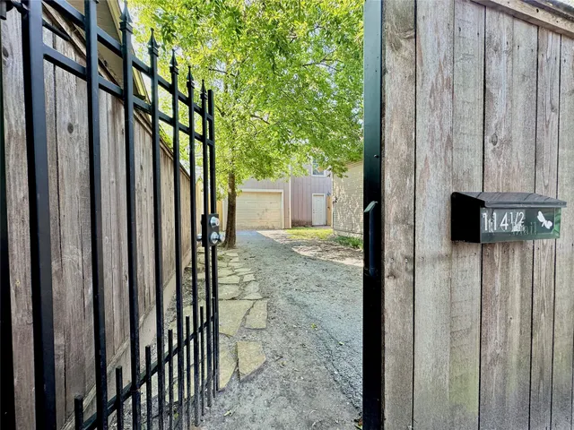 a view of a wooden fence next to a building