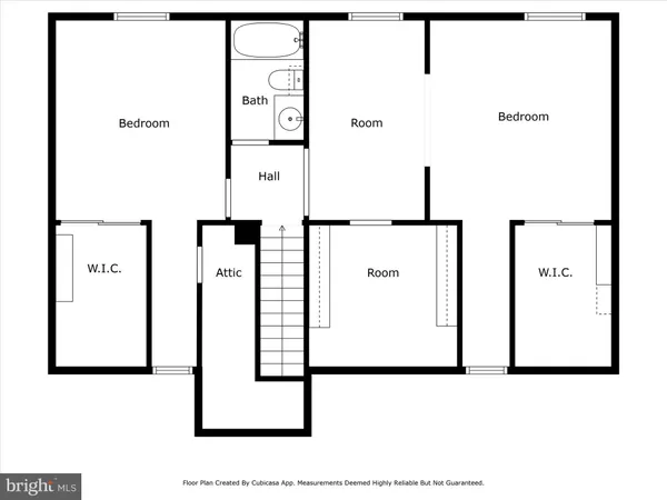 an empty room with a window and a ceiling fan