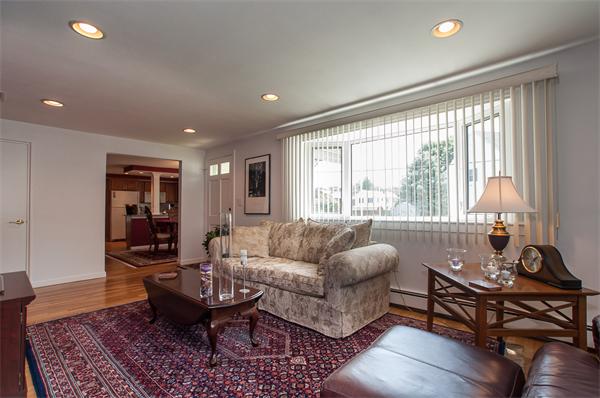 19 Carroll Road Woburn, MA 01801 - Photo 2 of 12 a living room with furniture and a large window