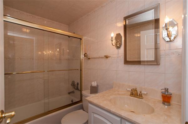 19 Carroll Road Woburn, MA 01801 - Photo 6 of 12 a bathroom with a sink toilet and shower