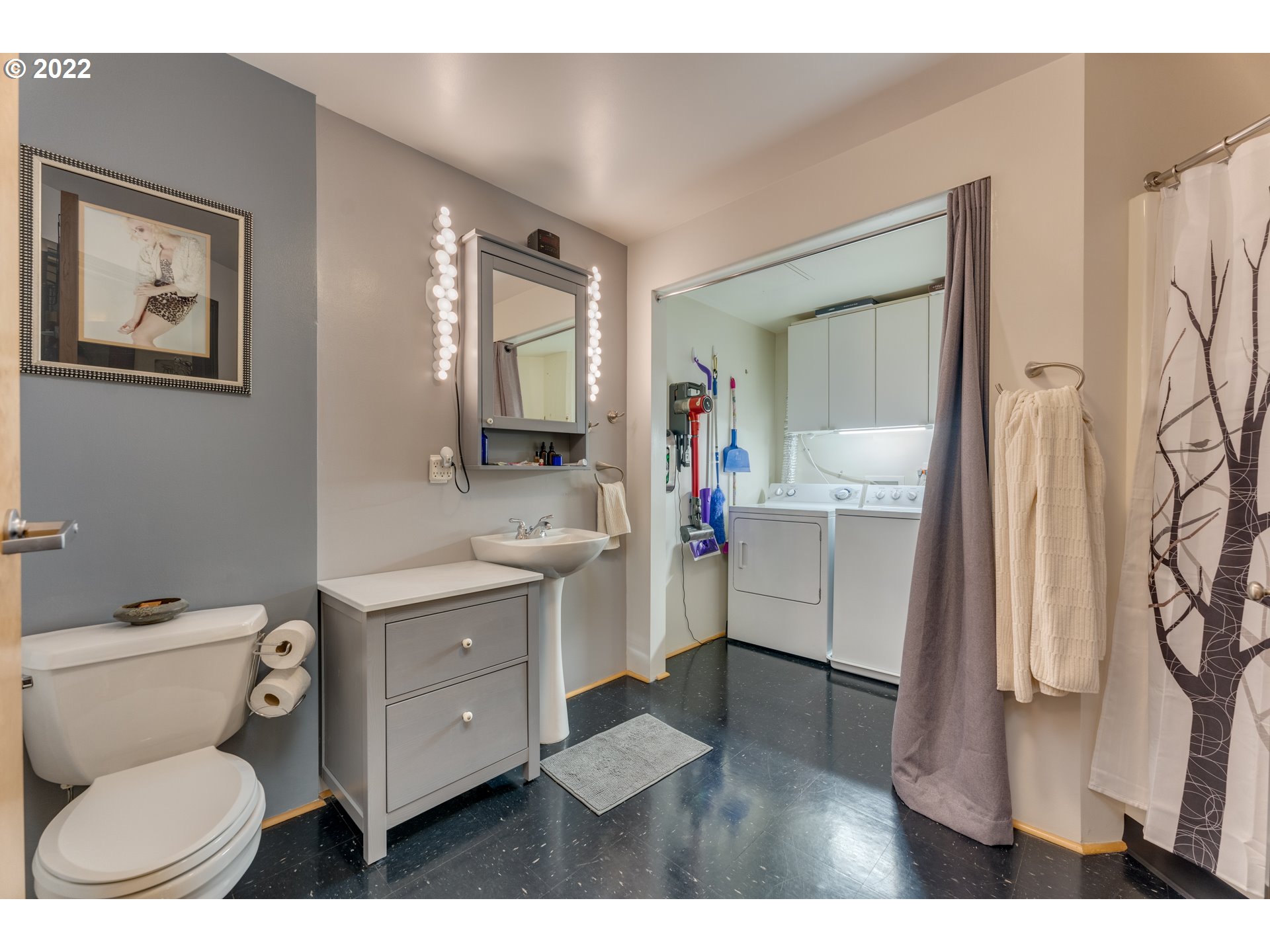 1420 Northwest Lovejoy Street, Unit 327 Portland, OR 97209 - Photo 20 of 27 a bathroom with a toilet sink and mirror