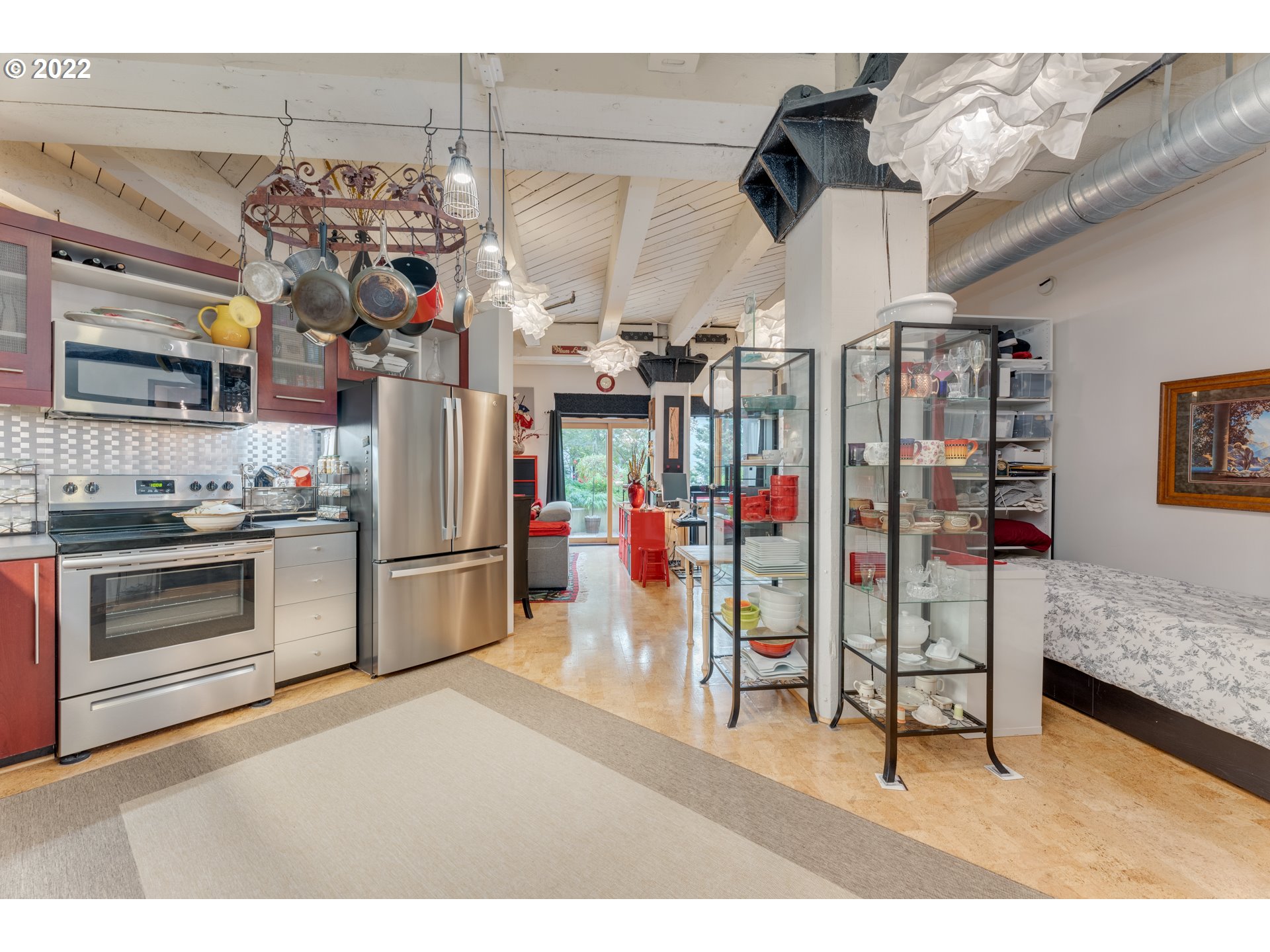 1420 Northwest Lovejoy Street, Unit 327 Portland, OR 97209 - Photo 7 of 27 a kitchen that has a lot of cabinets and a stove
