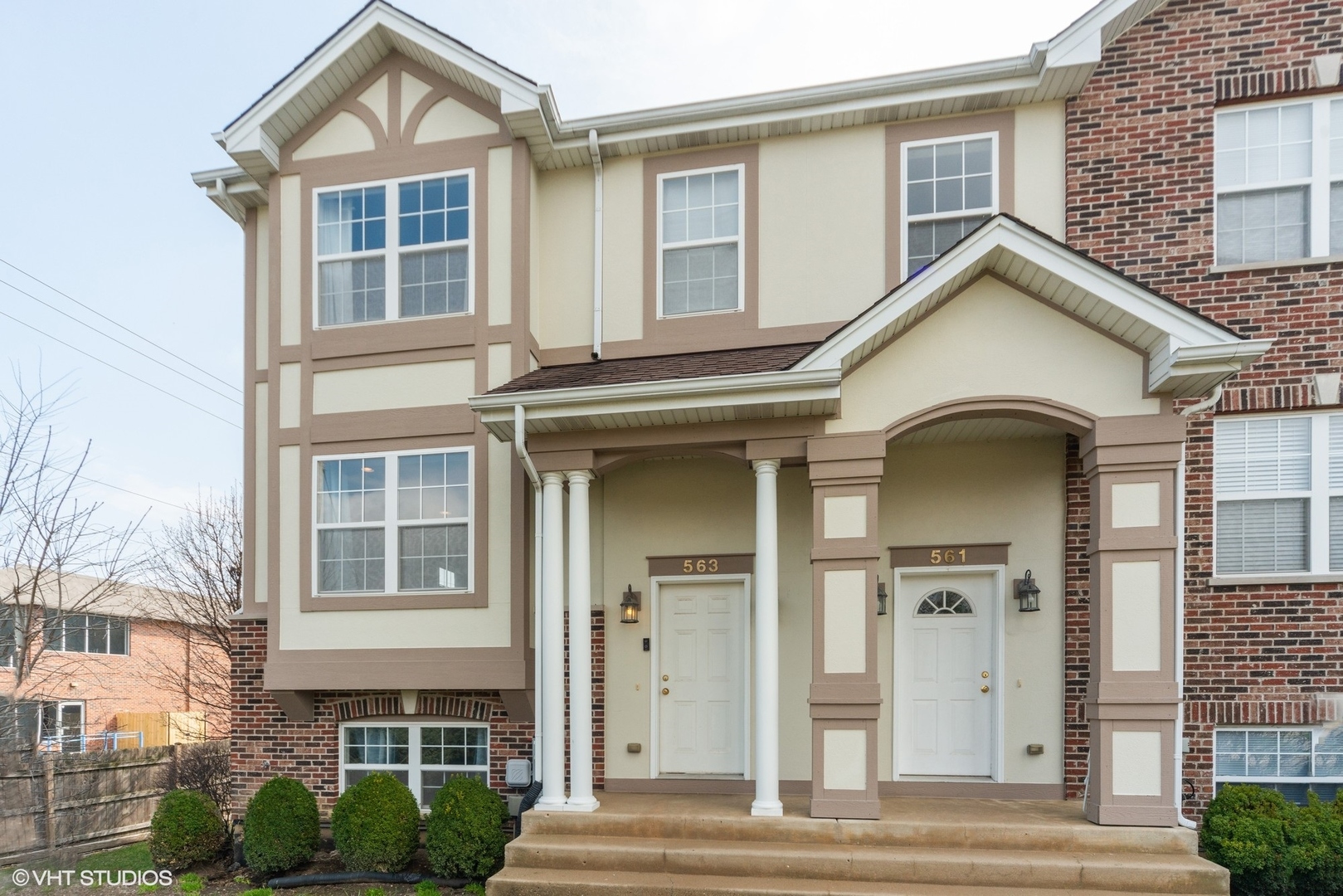563 George Street Wood Dale, IL 60191 - Photo 1 of 15 a front view of a house with a lots of windows and plants