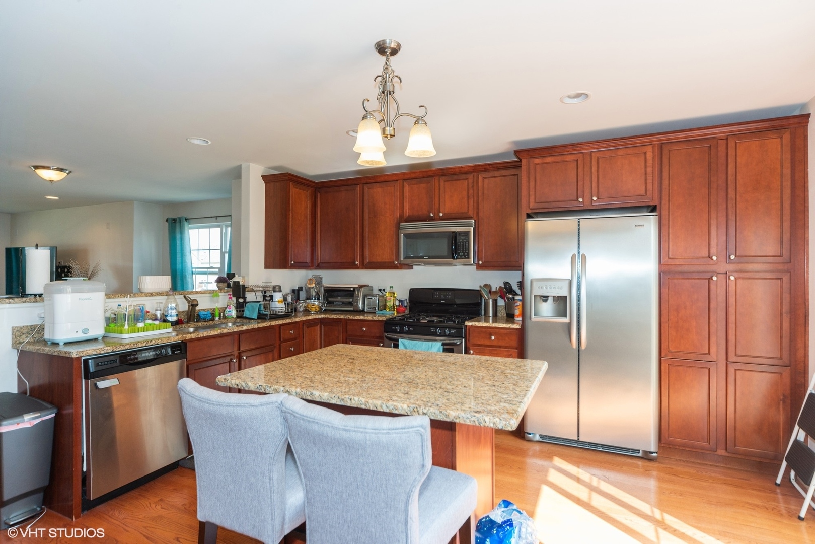 563 George Street Wood Dale, IL 60191 - Photo 7 of 15 a kitchen with stainless steel appliances granite countertop a sink a stove a refrigerator cabinets and a dining table