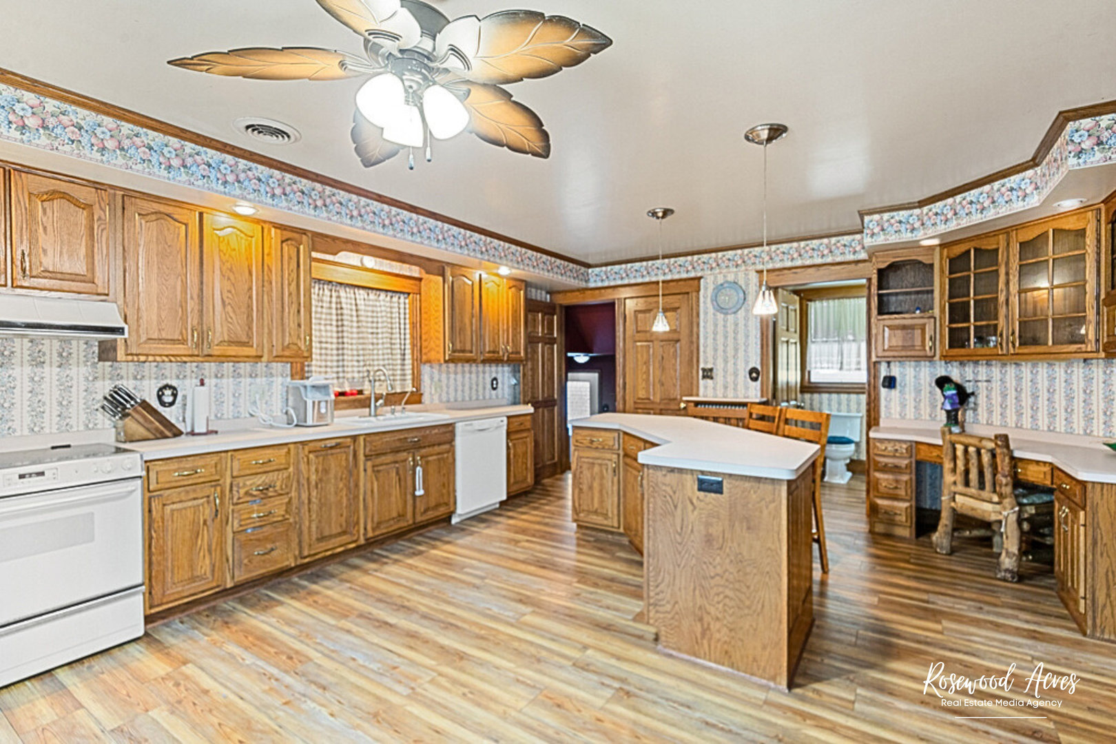 502 South Main Street Long Point, IL 61333 - Photo 5 of 22 a large kitchen with a lot of counter space and a wooden floor