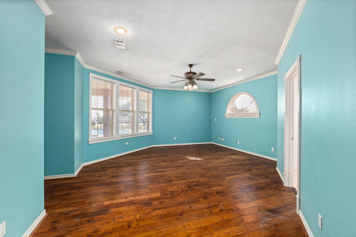 803 South Converse Street Flatonia, TX 78941 - Photo 18 of 35 a view of empty room with window and wooden floor