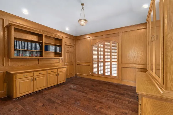 a kitchen with granite countertop cabinets and window