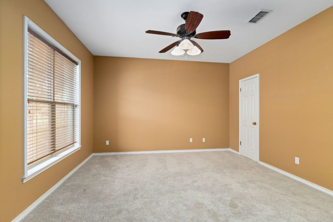 803 South Converse Street Flatonia, TX 78941 - Photo 28 of 35 a view of room with a ceiling fan and window