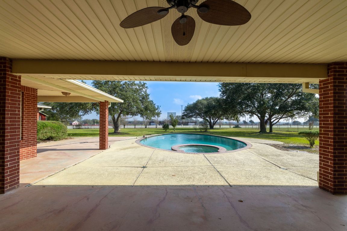 803 South Converse Street Flatonia, TX 78941 - Photo 31 of 35 an outdoor view of a house with a swimming pool