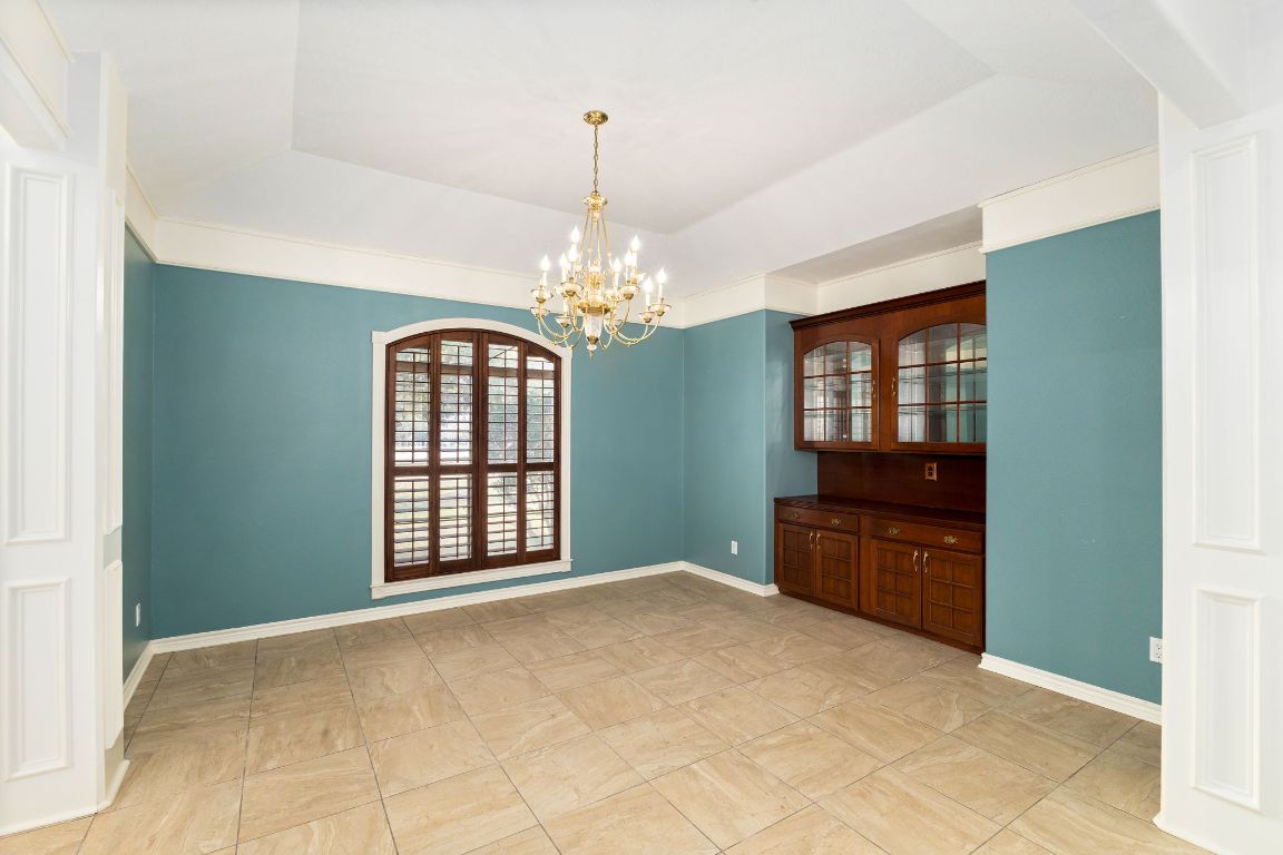 803 South Converse Street Flatonia, TX 78941 - Photo 6 of 35 a view of a bedroom with windows and chandelier