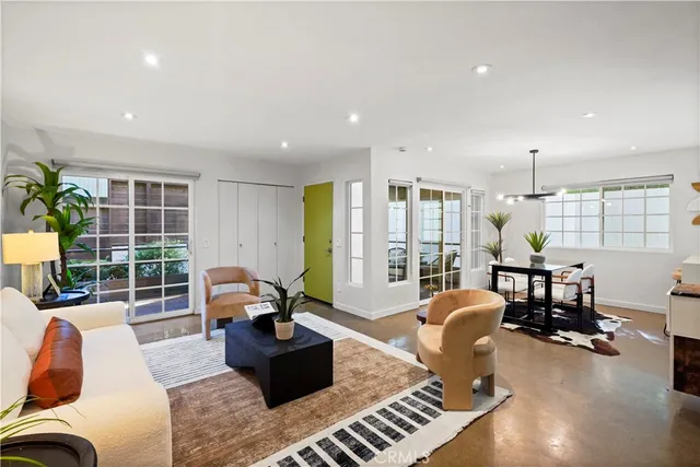 a living room with furniture and a table