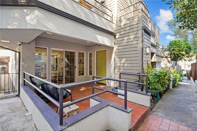 a view of a chairs with a bench in the patio