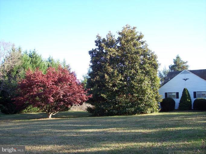 115 Ashton Road Ashton, MD 20861 - Photo 2 of 25 a front view of a house with a yard
