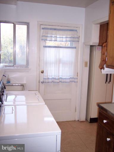 115 Ashton Road Ashton, MD 20861 - Photo 15 of 25 a bathroom with a bathtub and a window