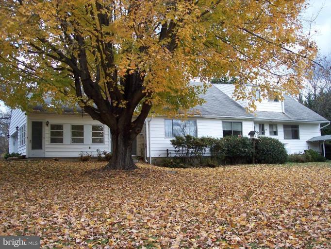 115 Ashton Road Ashton, MD 20861 - Photo 5 of 25 a front view of house with yard and trees