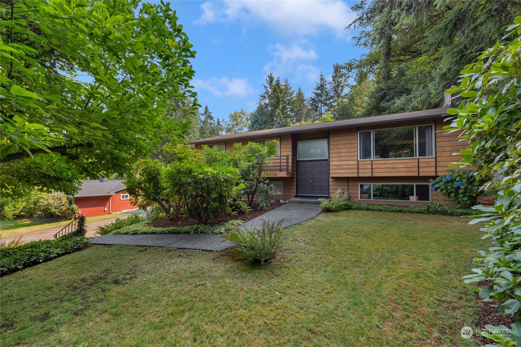 5616 227th Street Southeast Bothell, WA 98021 - Photo 1 of 38 a view of backyard with a patio and plants