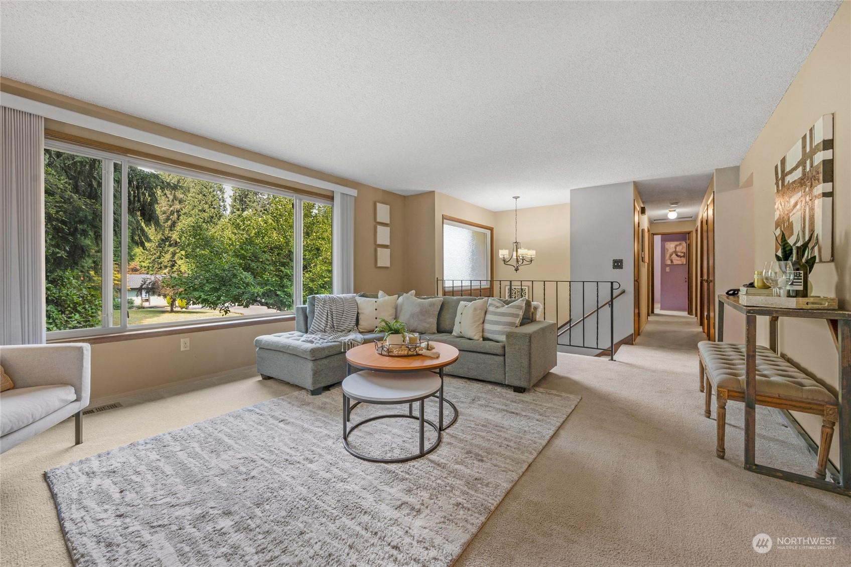 5616 227th Street Southeast Bothell, WA 98021 - Photo 18 of 38 a living room with furniture and a large window