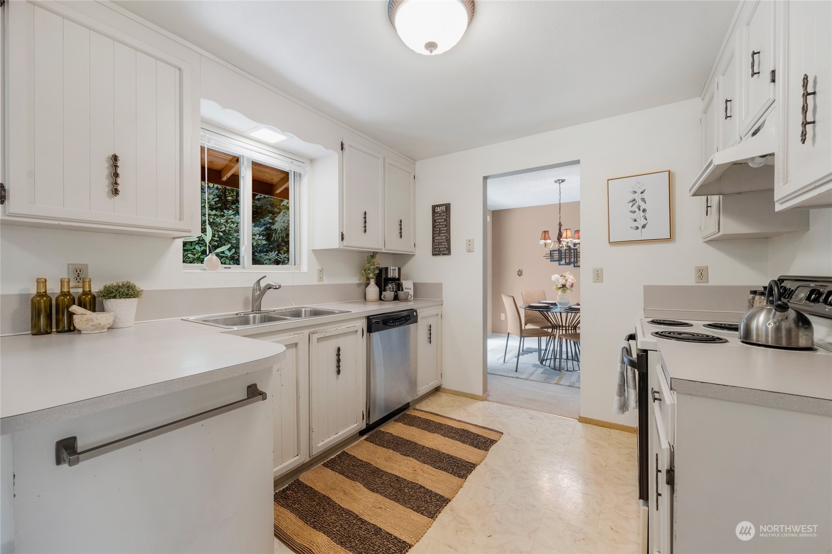5616 227th Street Southeast Bothell, WA 98021 - Photo 21 of 38 a kitchen with a sink stove and refrigerator