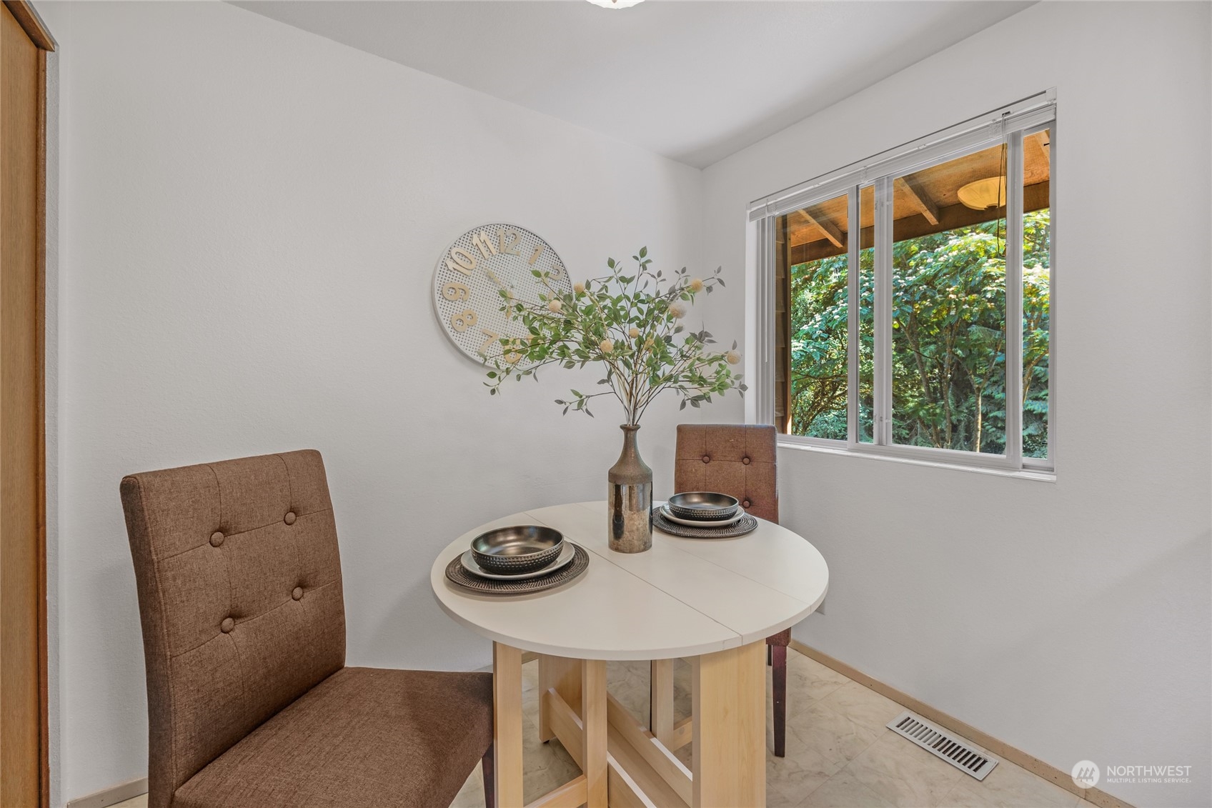 5616 227th Street Southeast Bothell, WA 98021 - Photo 22 of 38 a table and chairs in a room