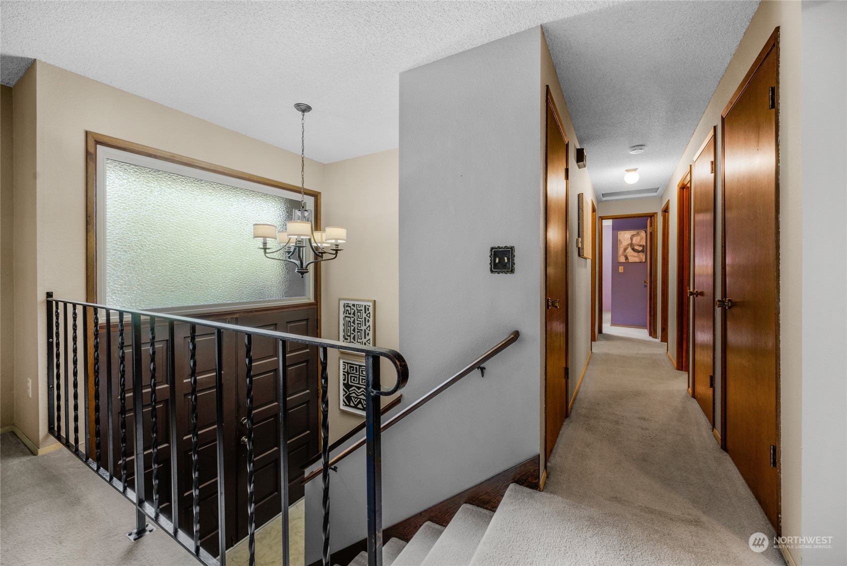 5616 227th Street Southeast Bothell, WA 98021 - Photo 24 of 38 a view of a hallway with a mirror