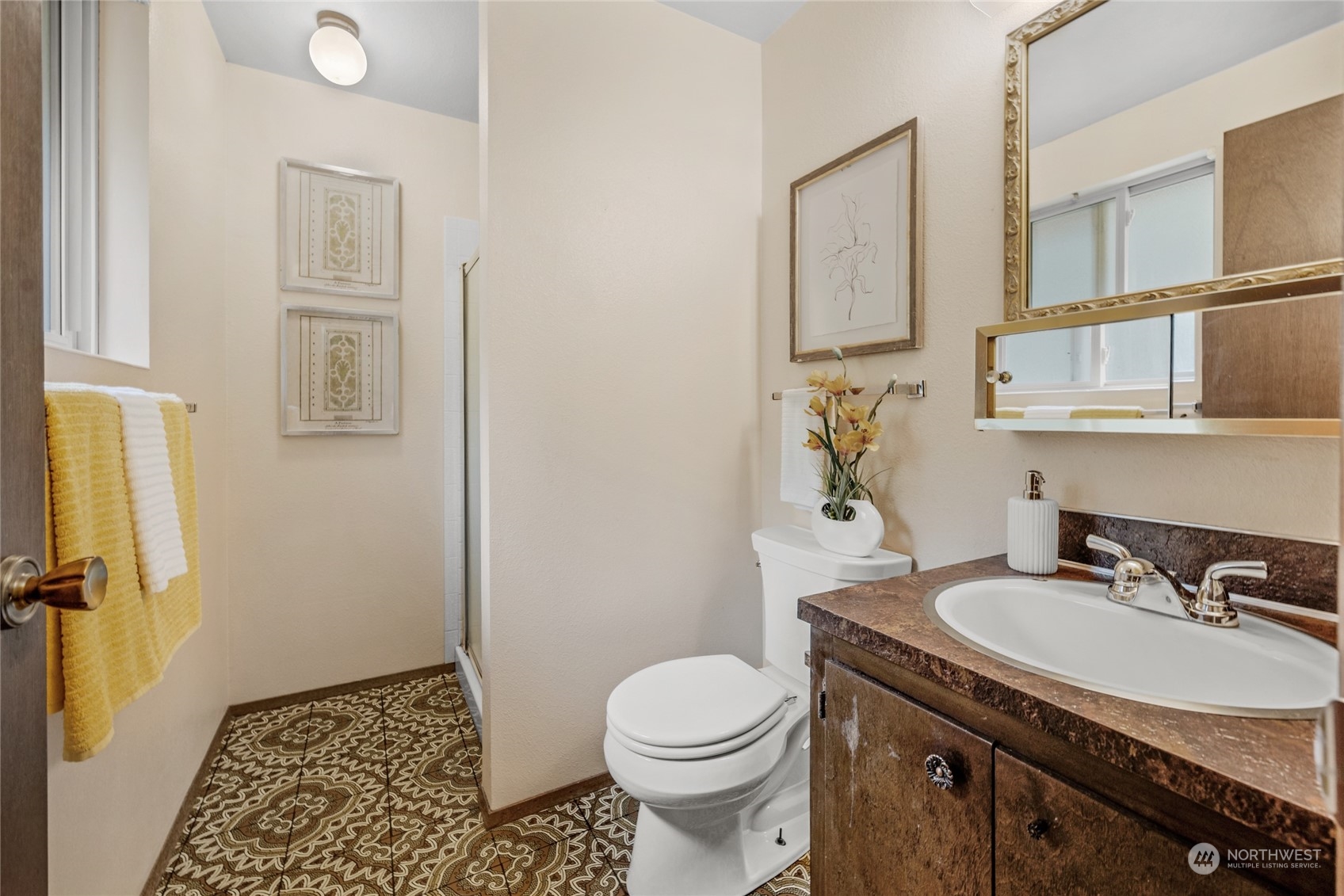 5616 227th Street Southeast Bothell, WA 98021 - Photo 26 of 38 a bathroom with a granite countertop sink toilet and shower