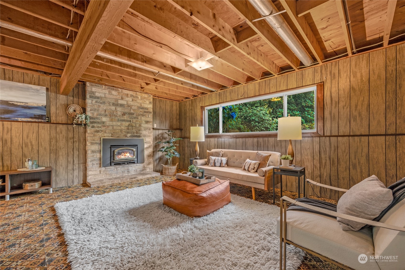 5616 227th Street Southeast Bothell, WA 98021 - Photo 30 of 38 a living room with furniture and a fireplace