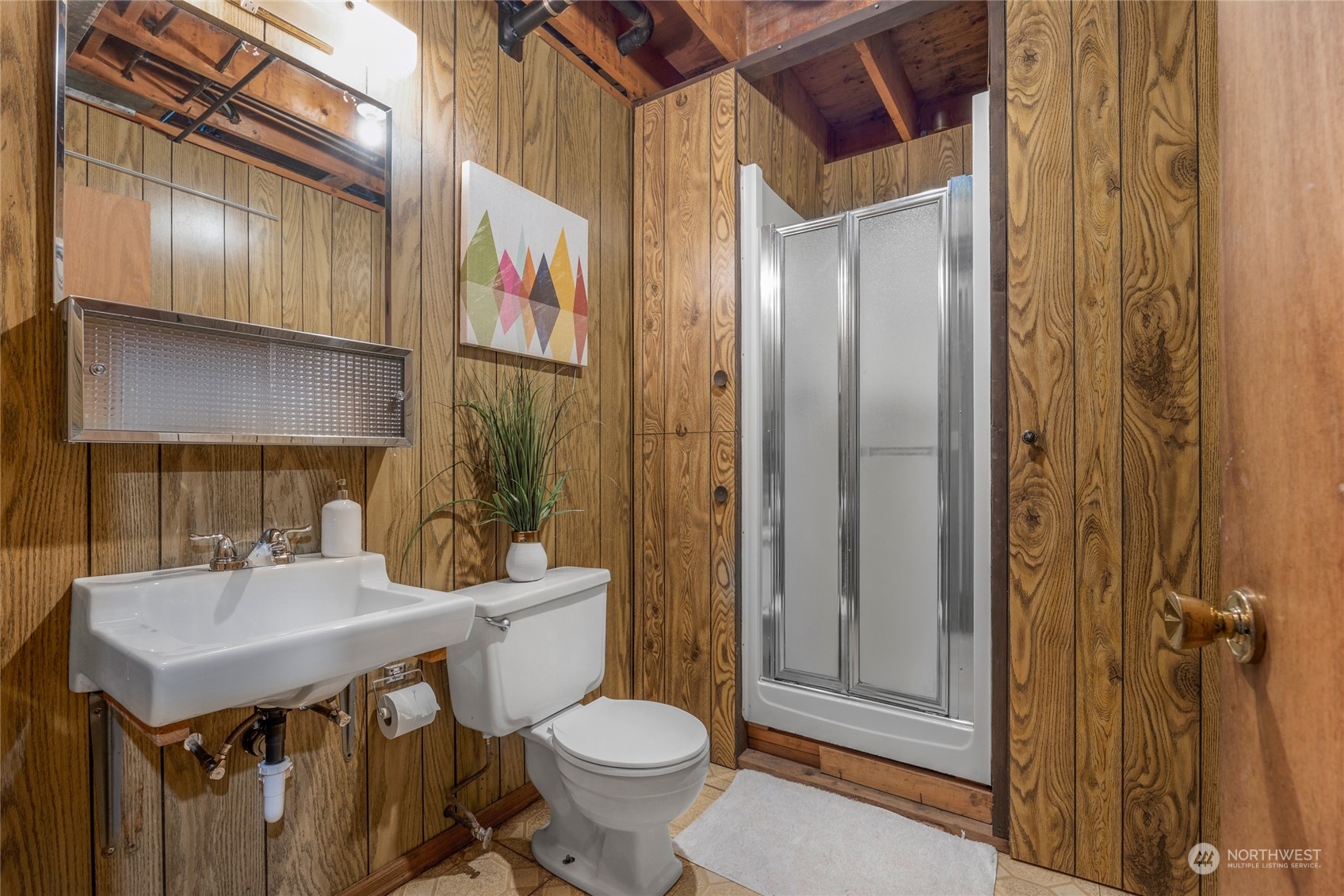5616 227th Street Southeast Bothell, WA 98021 - Photo 34 of 38 a bathroom with a sink a toilet and shower