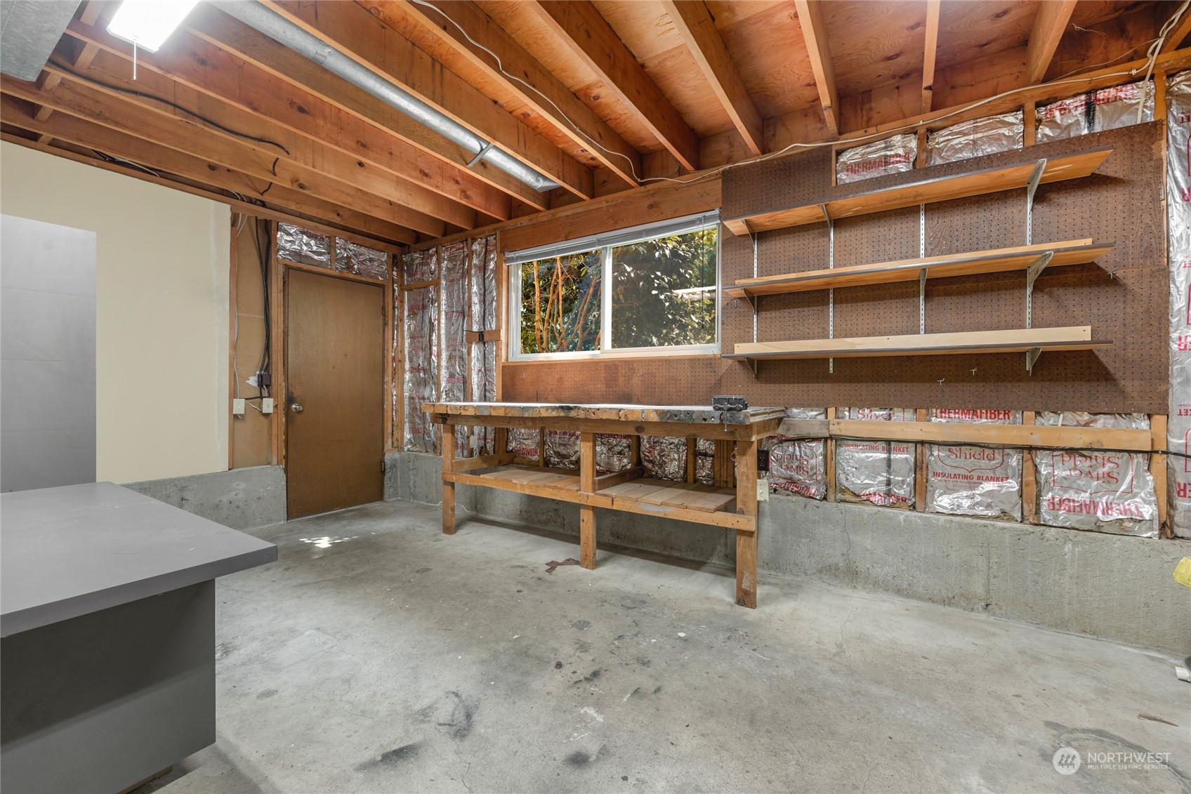 5616 227th Street Southeast Bothell, WA 98021 - Photo 37 of 38 a view of a room with shelves
