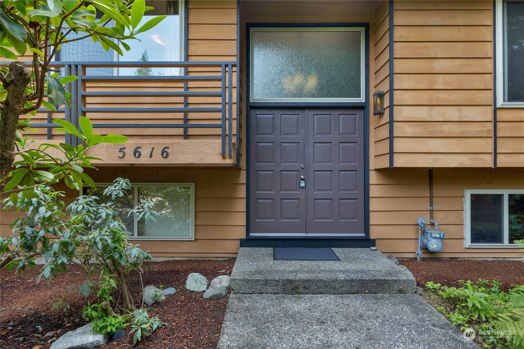 5616 227th Street Southeast Bothell, WA 98021 - Photo 38 of 38 a front view of a house with garden