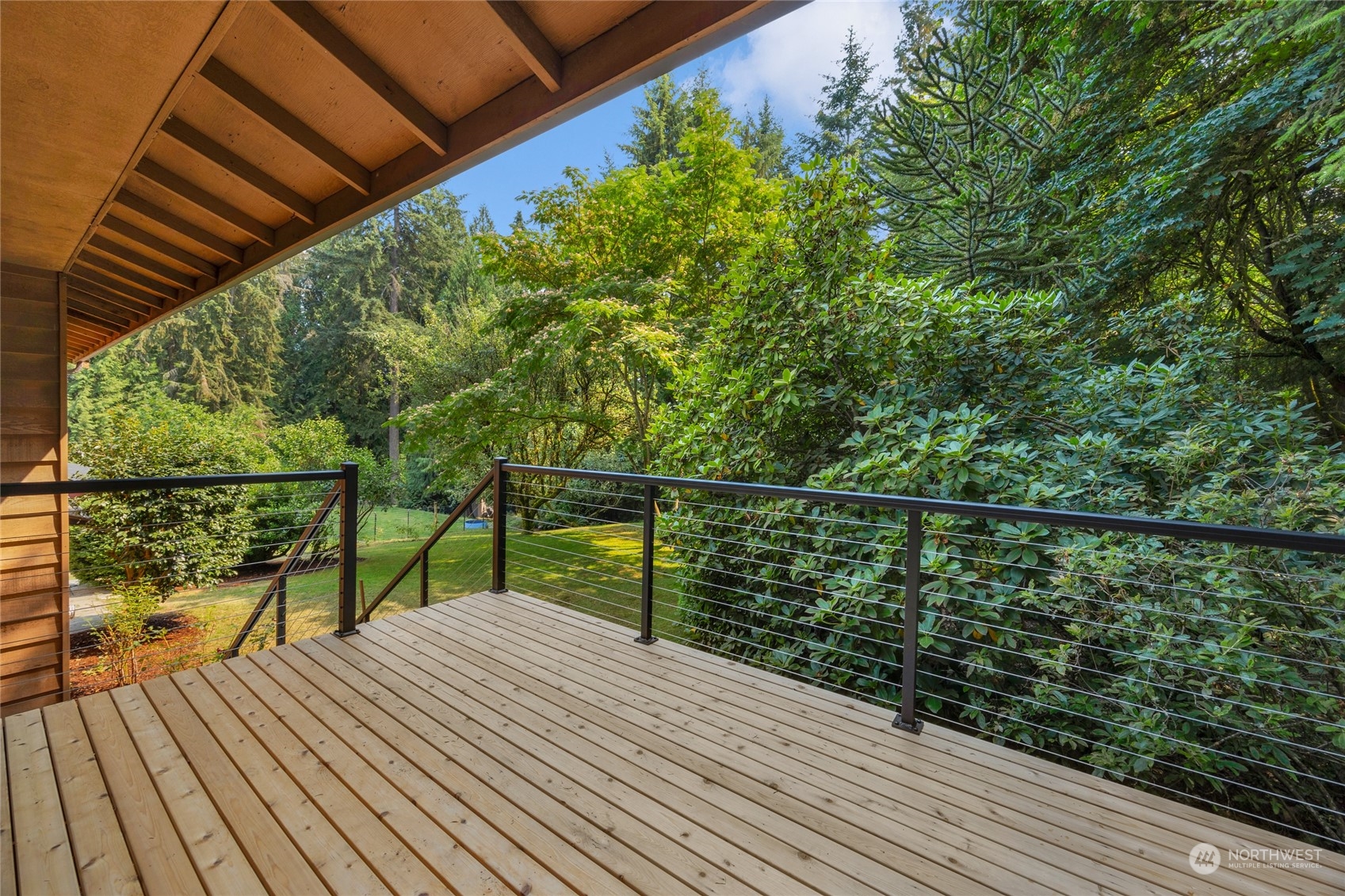 5616 227th Street Southeast Bothell, WA 98021 - Photo 9 of 38 a view of balcony with wooden floor and fence